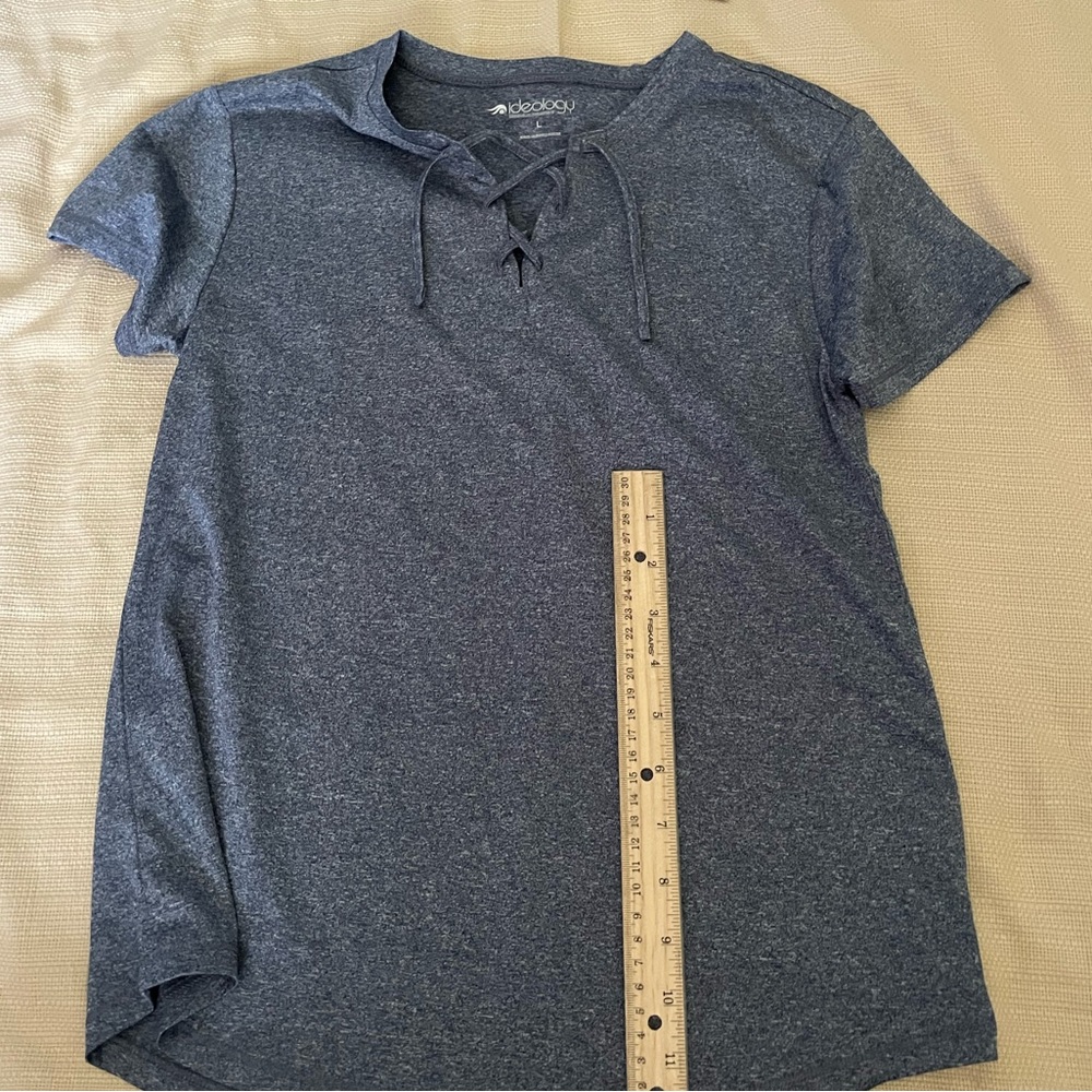 The brand of this shirt is ideology the color is a grey/blue! Size L in kids!